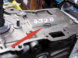 Figure 1: KA24 Nissan SOHC block may have timing chain wear that looks like a machined surface. The black square area is a hole into the coolant passage.