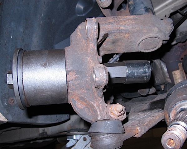 photo 7: tool in place to remove wheel bearing