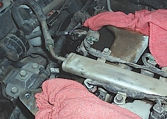 Fuel leakage into the intake manifold from a single-line fuel injection can come only from a leaking fuel injector.