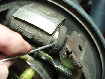 when inspecting a drum brake, always inspect the wheel cylinder for leakage by prying away the rubber end cap. because they can’t be successfully honed, aluminum wheel cylinders should be replaced.