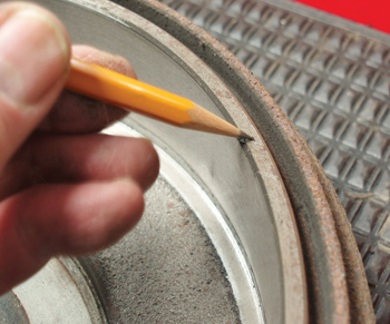The presence of a chamfer usually indicates if a brake drum can be resurfaced. At the minimum, I recommend a shallow cut to true the surface and remove the inner and outer wear ridges.