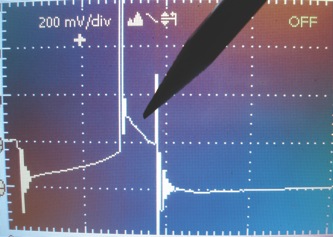 photo 2: the spark line in this scope waveform slopes downward, indicating high resistance in the wire or spark plug.