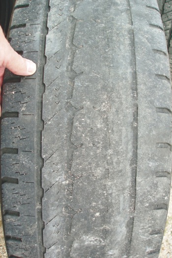 photo 2: this tire illustrates classic camber angle wear because the tread is worn smoothly with no rough, feather edges.