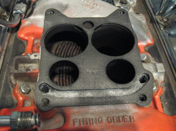 many of the pre-1970 general motors v8 ­engines had exhaust passages that traveled across the base plate of their carburetors. many tuners block this exhaust passage in an effort to reduce carburetor heat and reduce the failure rate of the rubber and plastic parts that are in most carburetors.