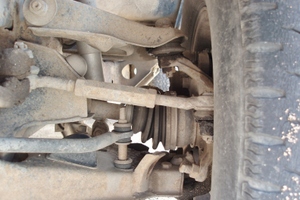 photo 1: due to the upper control arm swinging through a shorter arc than the lower control arm on this sla suspension, this tie rod might force the steering knuckle to a toe-out position as ride height increases.