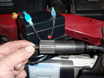 A small auxiliary power source such as this trailer brake  battery can maintain system voltage while the battery cables are disconnected.
