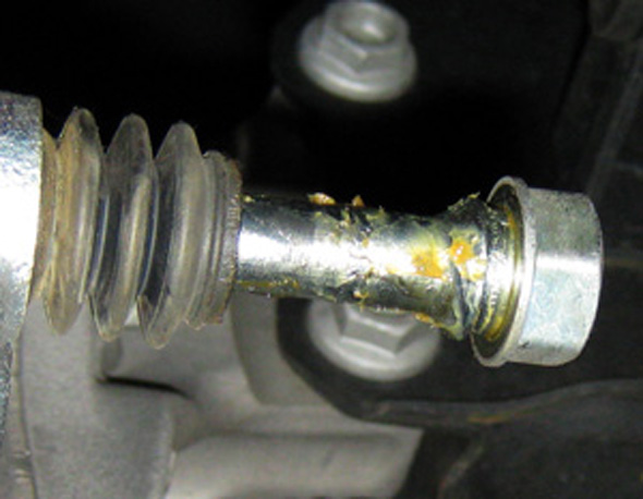 the guide pin bolts on the front brakes have a torque spec of 27 n·m (20 ft/lbs). gm advises that impact tools should not be used to remove these bolts. the flats on the pins use a 17 mm open-ended wrench. some wrenches might not fit.
