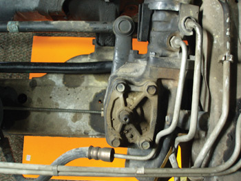 Photo 8: Although this steering gear might not appear to be in alignment with the connecting link, an imaginary line drawn from the sector shaft adjusting screw to the center of the pitman arm mounting stud creates a perfect 90° angle when the wheels are in a straight-ahead position.