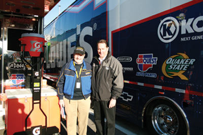 mike gregg (left) says the race track is a great testing ground for belt durability. he’s shown here at the track with jeff andrews, director of engine operations at hendrick motorsports.