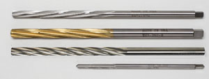 Titanium coated reamers are smooth, precise and are less brittle and cost less than carbide.