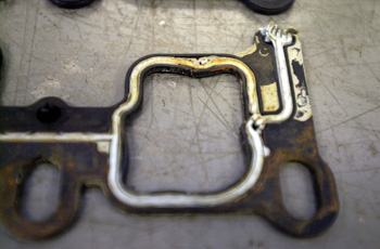 The coolant leaks on certain “problem” engines are the result of a combination of factors: heat, thermal cycling, coolant neglect, corrosion and degradation of the OEM gasket.