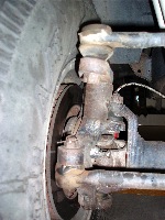 photo 5: to prevent bump steer, this special aftermarket steering knuckle raises the steering gear connecting link to a level position. notice the extreme wheel offset required for the tire to clear the custom knuckle. 