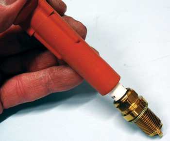 use a clean spark plug boot or dedicated holding tool to handle and install new spark plugs.
