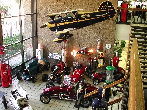the museum entry not only contains cars and automobilia, but a beautiful pitts bi-plane hanging is from the ceiling. eclectic, you bet