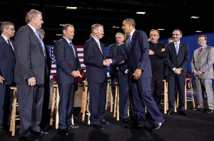President Barack Obama greets Ford President and CEO of Ford Alan Mulally and other auto industry executives following his remarks on fuel efficiency standards for 2017-2025 model year cars and light-duty trucks during an event at the Washington Convention Center in Washington, D.C., July 29, 2011. (Official White House Photo by Pete Souza)