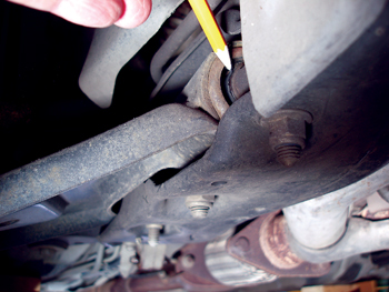 photo 8: with the vehicle weight removed from the control arm, this lower control arm bushing is clearly deteriorated.