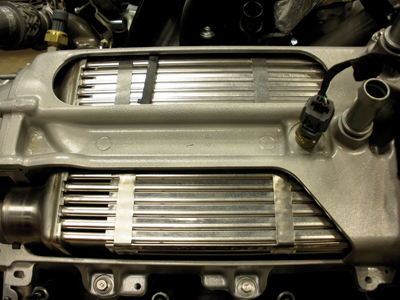 An intercooler, like this one used on a Ford Powerstroke, is an air-to-air heat exchange device used on turbocharged and supercharged engines to improve their volumetric efficiency by increasing intake air charge density.