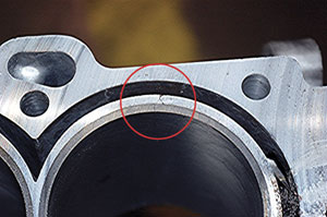 figure 1: the aluminum 4.6l cadillac block may crack outside the cast iron cylinder liner and is extremely hard to detect. the above crack became visible only after the deck face was machined.