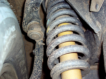 photo 1: because coil springs are dependent on shock absorbers for rebound control, shock absorbers must be capable of dampening rebound under a wide variety of loading and road surface conditions.