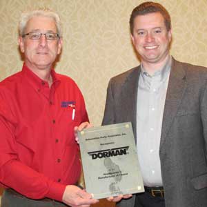 apa awarded its headquarter's manufacturer of choice award to dorman products. doug arnold (at right), vice president sales, traditional, accepted the award from apa member jeff levine. 