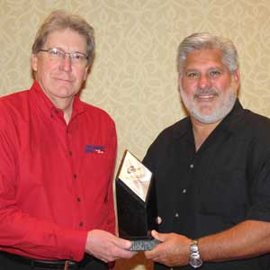 Centric Parts was named the APA Branded Manufacturer of the Year, for the fifth consecutive year. Mike Musso (at right), vice president of sales, accepted the award from APA member Gene Bochinski.