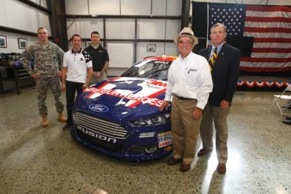 (L-R) SSgt. Caruthers, U.S. Army; Greg Biffle, driver of the No. 15 3M Ford Fusion; Sgt. Grant, U.S. Army; Jack Roush, owner, Roush Fenway Racing, Lt. Gen. Tom Waskow, U.S. Air Force (ret.) and board member of USO-NC.