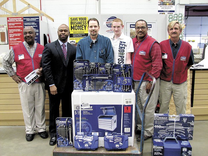 From left, Bobbie Batten, commercial sales specialist at Lowe's; Corey McCray, director at the Pruden Center; Tony Pearce, automotive services technology instructor at the Pruden Center; Alex Brueggeman, automotive services technology student at the Pruden Center; Kenny Hines, Zone 3 manager for Lowe's; and Jerry Moore, commercial sales specialist for Lowe's (photo by  Tracy Agnew).