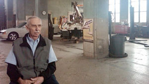 Harvey Davis in his train depot/auto repair shop.