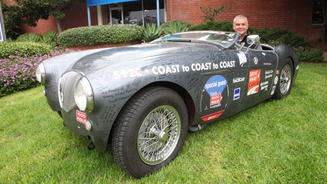 John Nikas in a 1953 Austin-Healey 100 that he plans to drive through 50 states this summer.